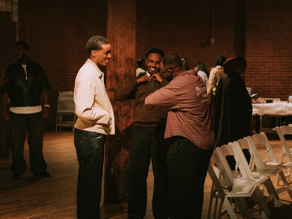 Attendees networking at the venue