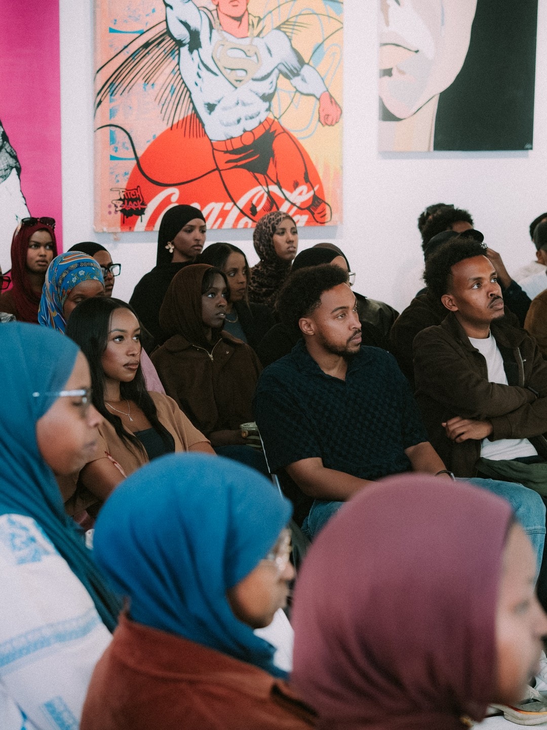 The audience watching a panel at a past event