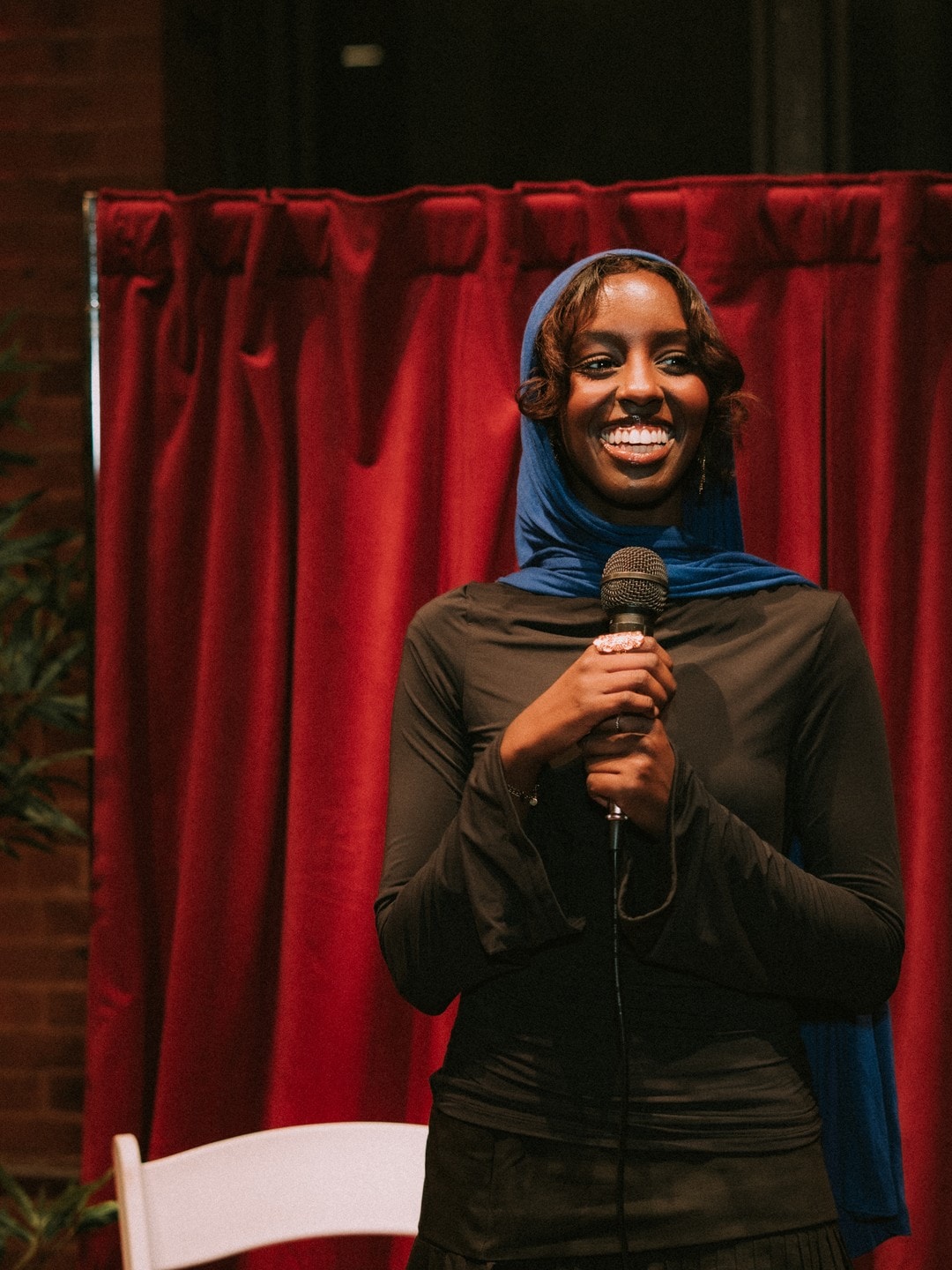 A speaker on stage during the comedy night